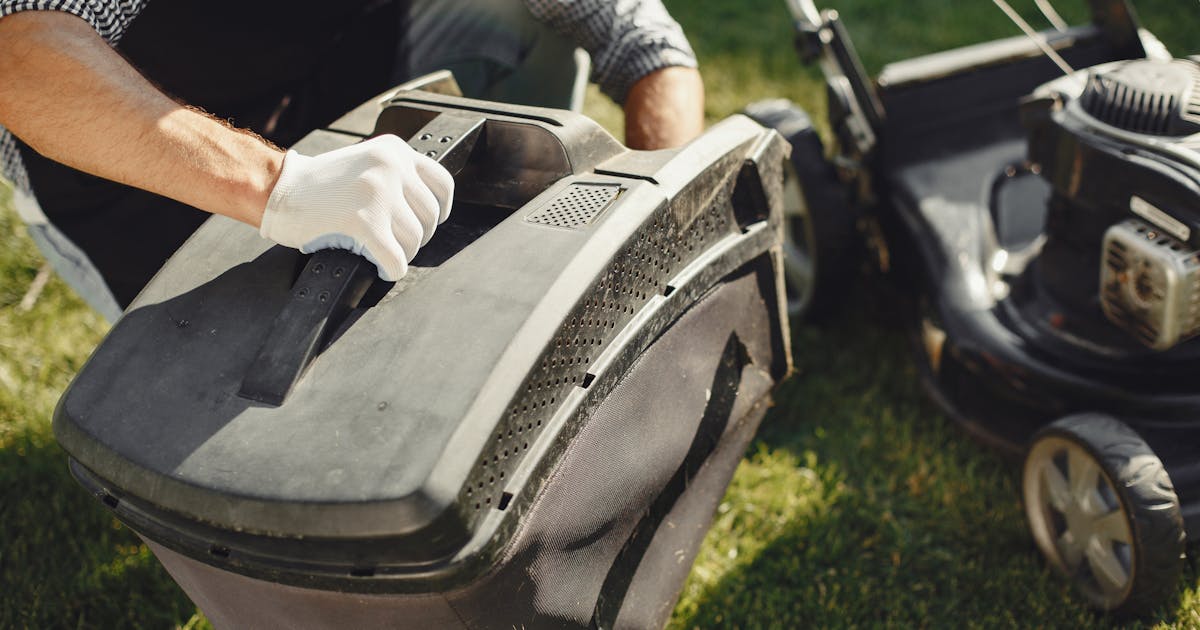 Battery electric mower in a yard