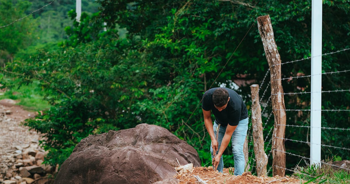Digging a post hole for a fence