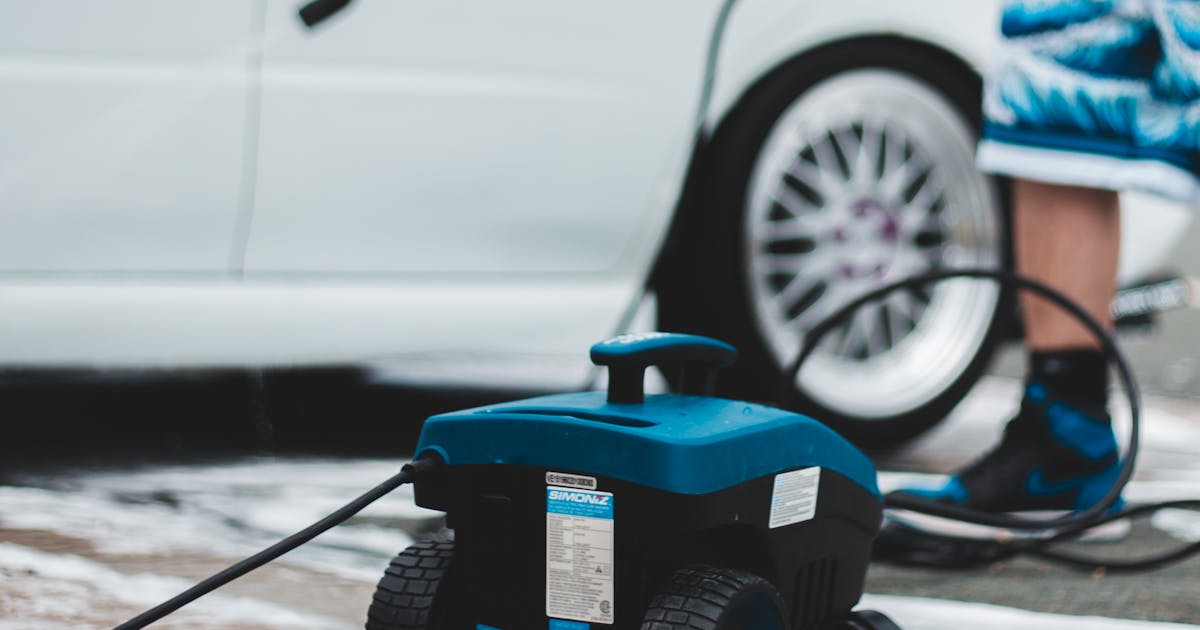 Pressure washer cleaning a driveway