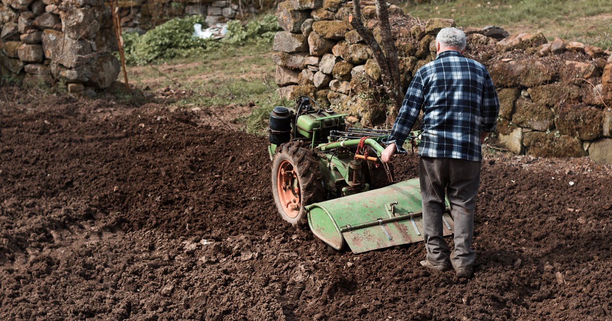 Garden tiller cultivating soil