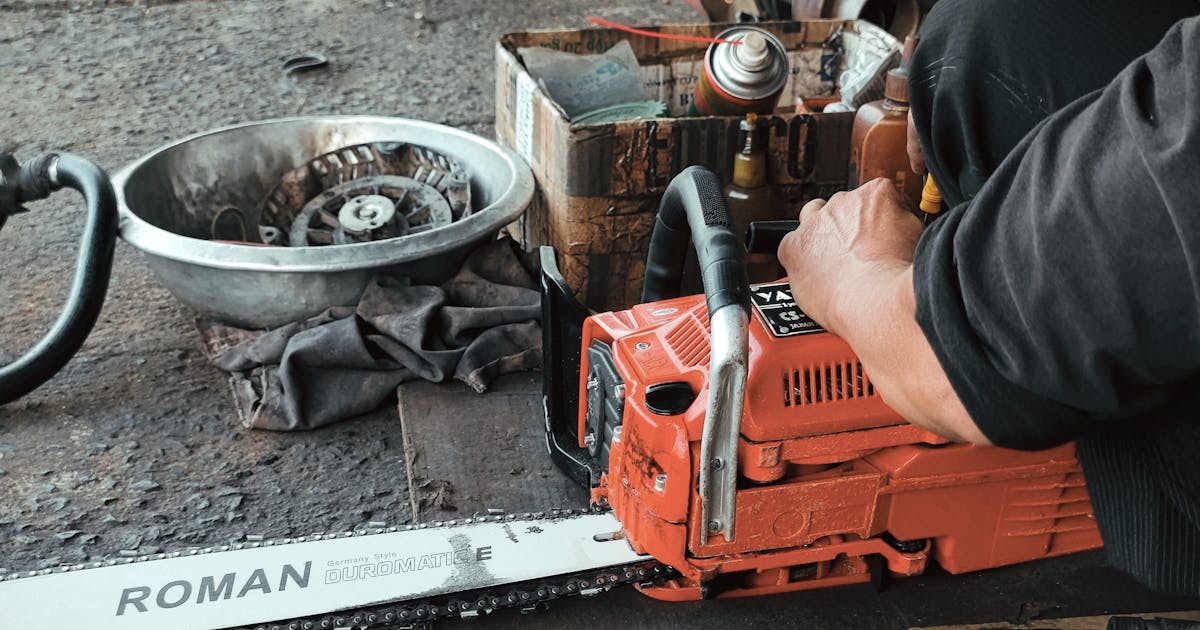 Chainsaw being maintained and oiled
