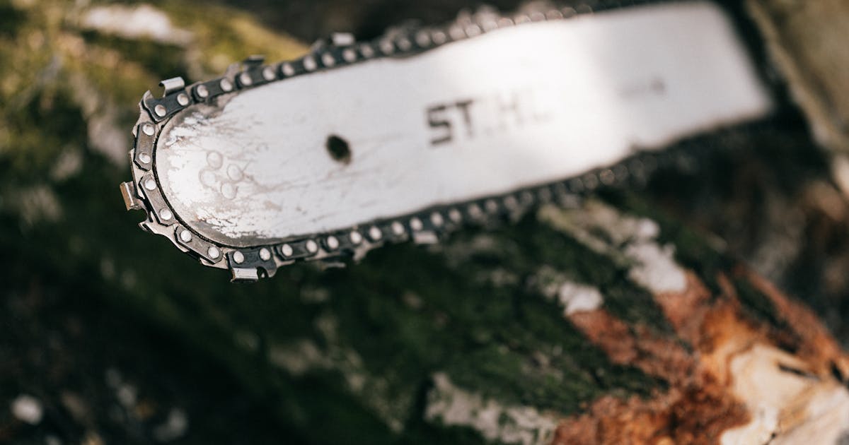 Close-up of chainsaw chain being sharpened